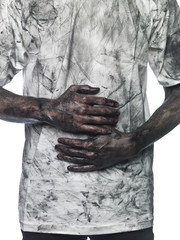 Dirty hands in front of a dirty shirt