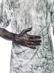 Dirty hand towards a dirty t-shirt