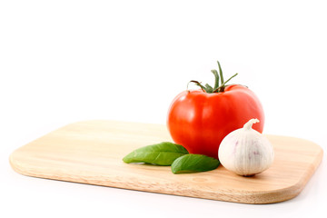 Tomato, Garlic and Basil on Cutting Board