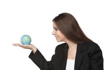 Business woman looking at the earth in her hand isolated on white background