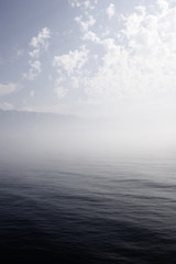 Fototapeta na wymiar greek coast with clouds and fog
