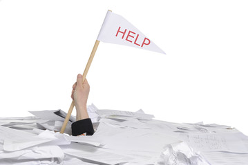 hand with help flag sticking out of desk full of paper