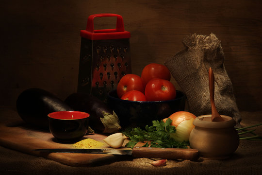 Kitchen still life with vegetables and utensils