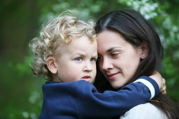 Kid on mothers hands.