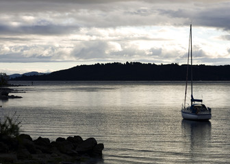 Sail Boat in Water at Dusk