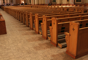 Rows of pews in beautiful cathedral.