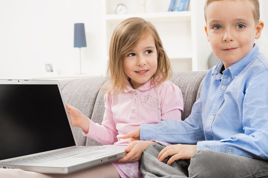 Children with laptop computer