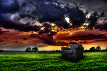 Abstract armchair in the idyllic field