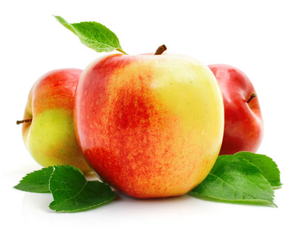 red apple fruits with green leaves