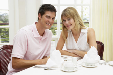 Young Couple Enjoying Hotel Meal
