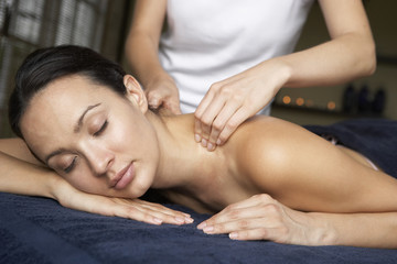 Fototapeta na wymiar Young Woman Enjoying Massage