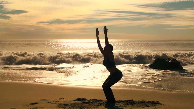 Yoga chair pose at sunset