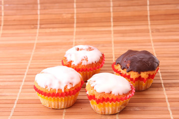 Coffee with milk color cup with cakes on white background