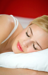 Obraz na płótnie Canvas Portrait of sleeping beautiful woman on bed at bedroom