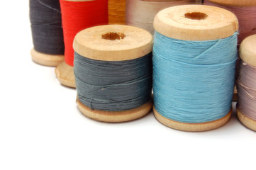 Old Thread reels of different colors . Isolated