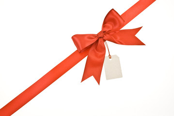Red ribbon and bow with label isolated on white background
