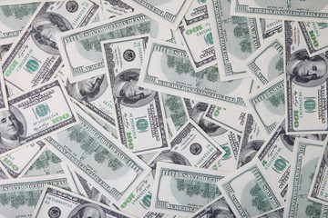 One hundred dollars pile as background