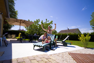 happy family on the terrace of their house