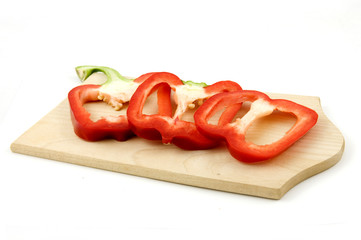 Sliced red paprika on wooden cutting bord