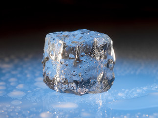 Ice cube on blue