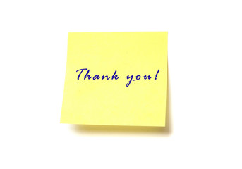 Yellow post it with words "Thank you" isolated on white