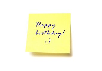 Yellow post it with words "Happy birthday!" isolated on white