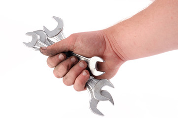 a metallic wrench is in a hand