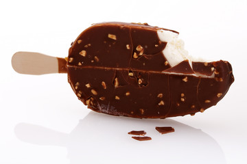 .ice cream covered with chocolate and almonds.