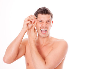 man beautifying with tweezing eyebrow