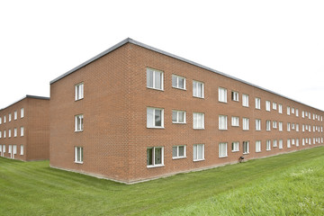 Obraz premium Brick wall building on a cloudy day