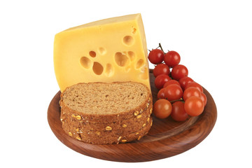 big chunk of yellow cheese with tomatoes and bread