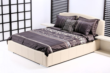 A view of a modern bed in a bedroom