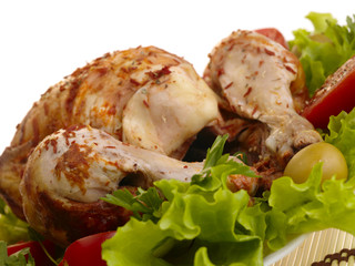grilled chicken whole with vegetables on salad leafs