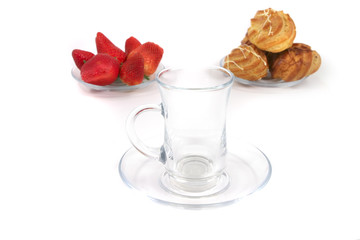 empty tea cup with eclair