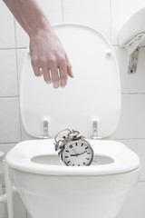Throwing the alarm clock in the toilet