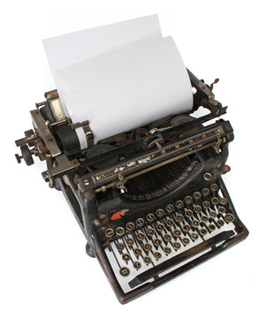 Old typewriter with a blank paper