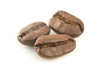 Obraz premium Three coffee beans close up.