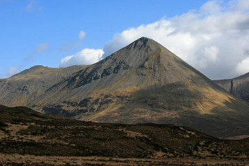 Fototapeta premium Clouds passing over a mountain on the Isle of Skye, Scotland.