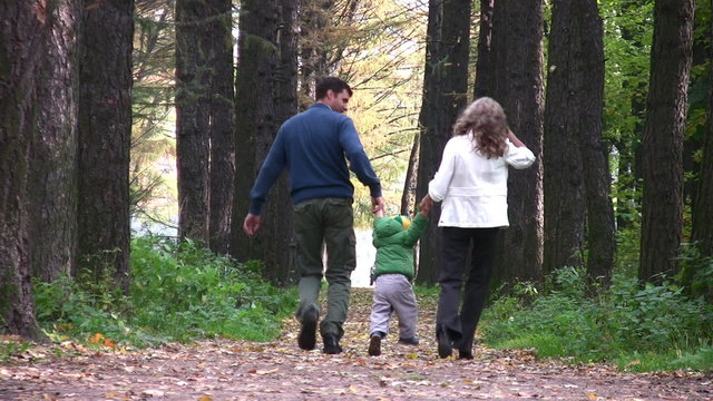 behind parents with boy in park