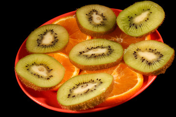 Sliced Orange and kiwi on plate