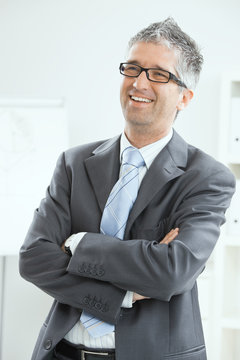 Happy businessman at office