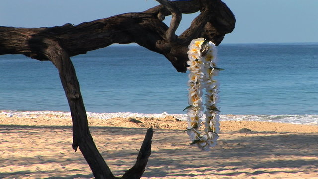 Traditional Hawaiian lei on the beach, Big Island of Hawaii.