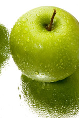 Green apple with water drops