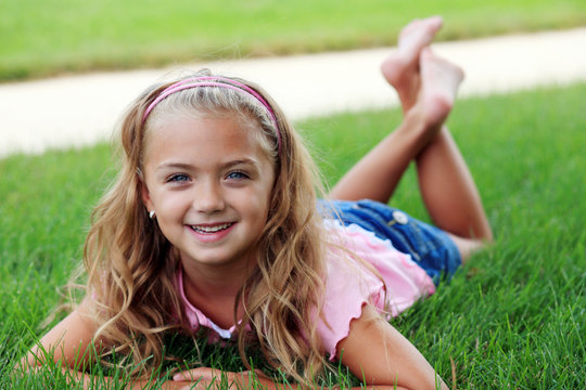 little girl in grass