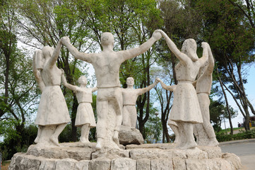 Naklejka premium Sardana dancers statue in Barcelona Spain