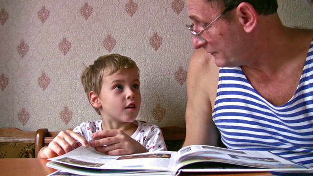 senior with child read book