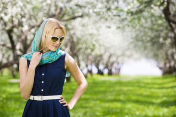 Pensive woman in garden
