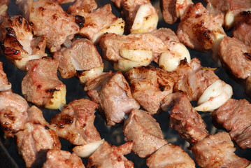 Preparation of meat on fire