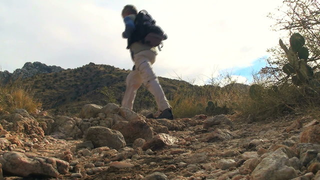 Hiker in desert landscape low ange shot - HD
