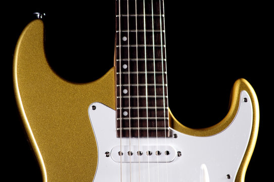 Gold Guitar Isolated on Black